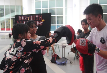 Attendees trying out boxing for the first time