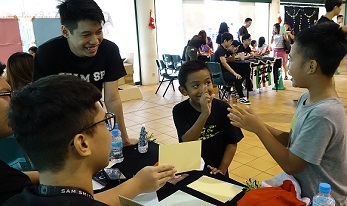 Participants in action at game booths