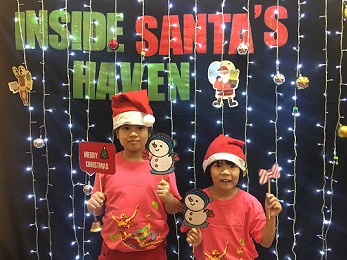 Children posing at the photo booth